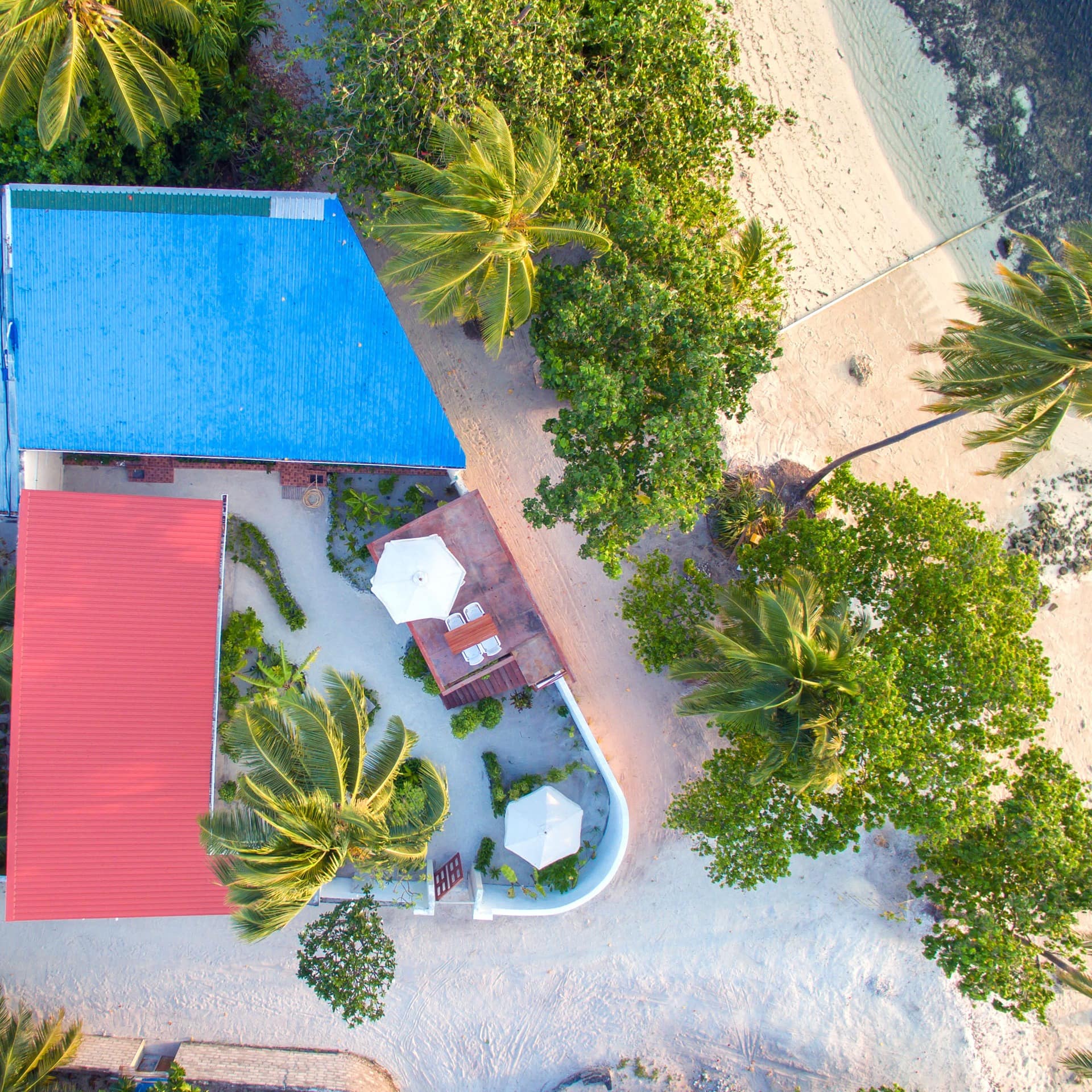A bird's-eye shot of a beach villa in the Maldives
