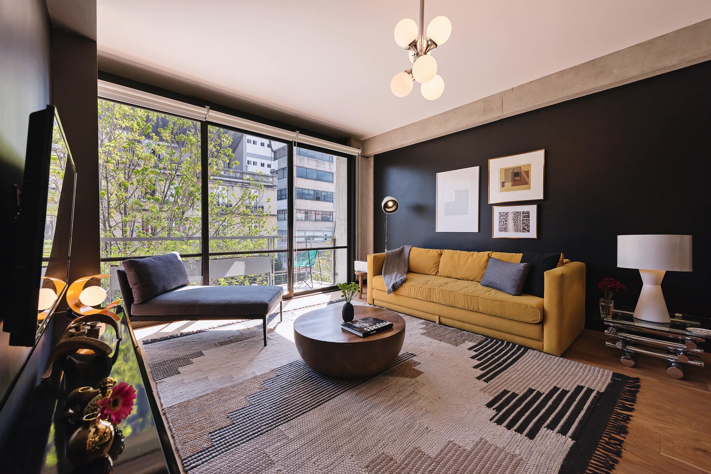 This modern apartment in Roma Norte features a private balcony