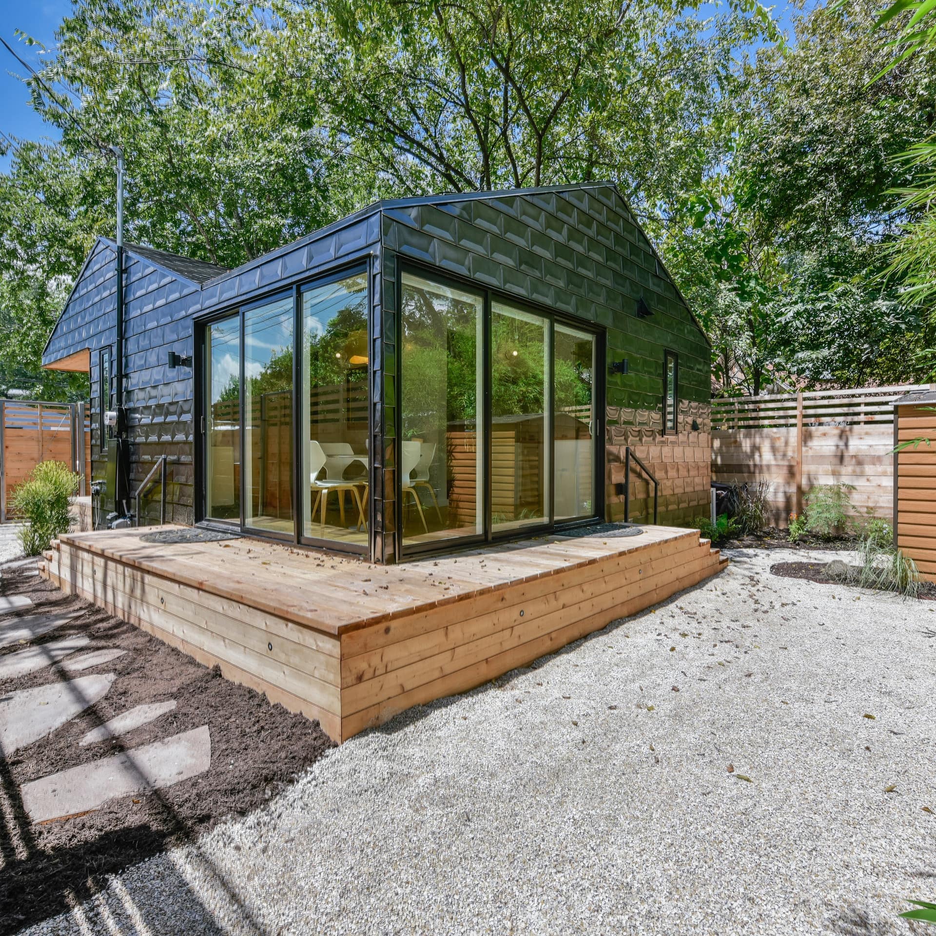 An off-beat rental in a metal-clad shed with big windowed doors and a deck