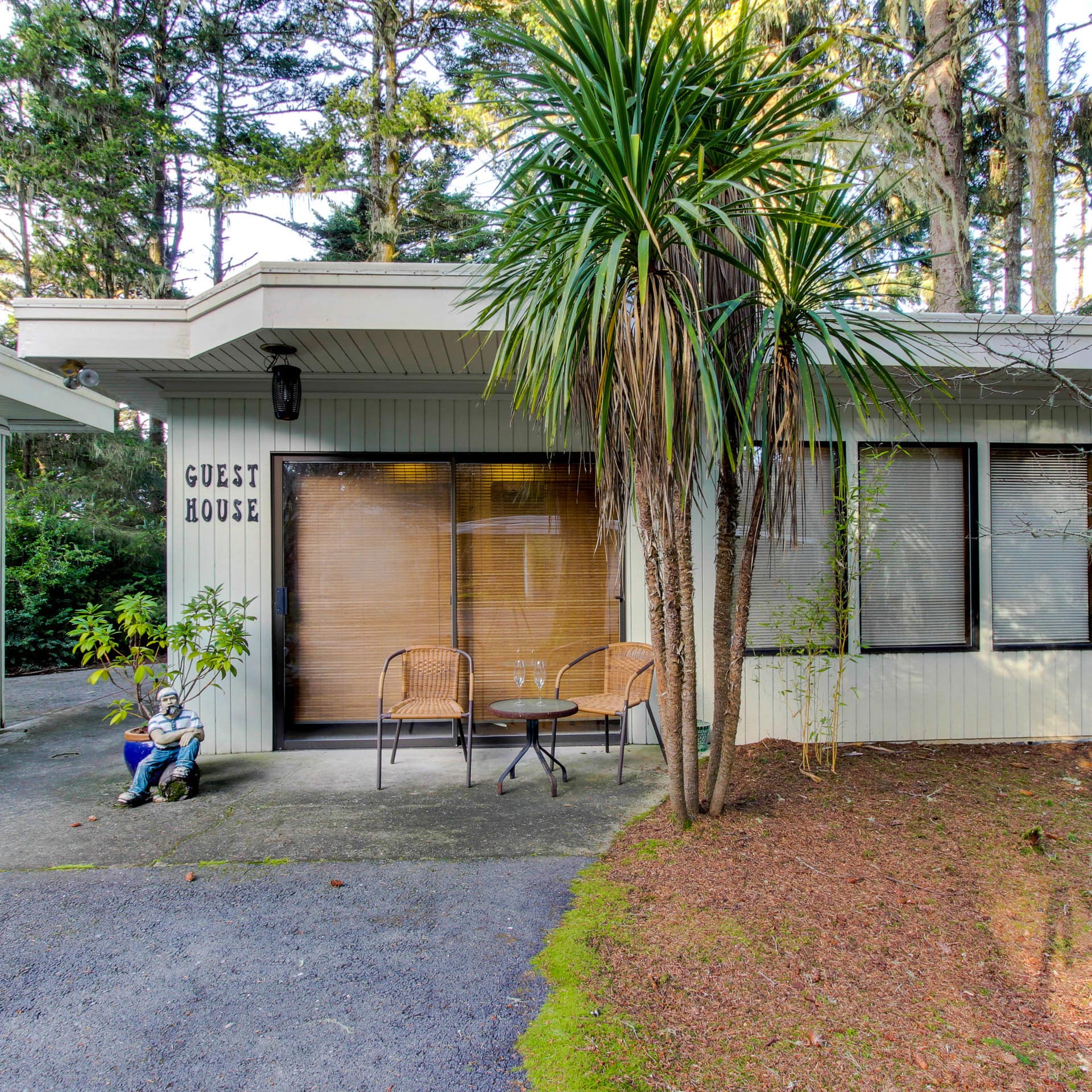 A bungalow B&B is huddled under coastal pine trees just back from the shoreline of Oregon