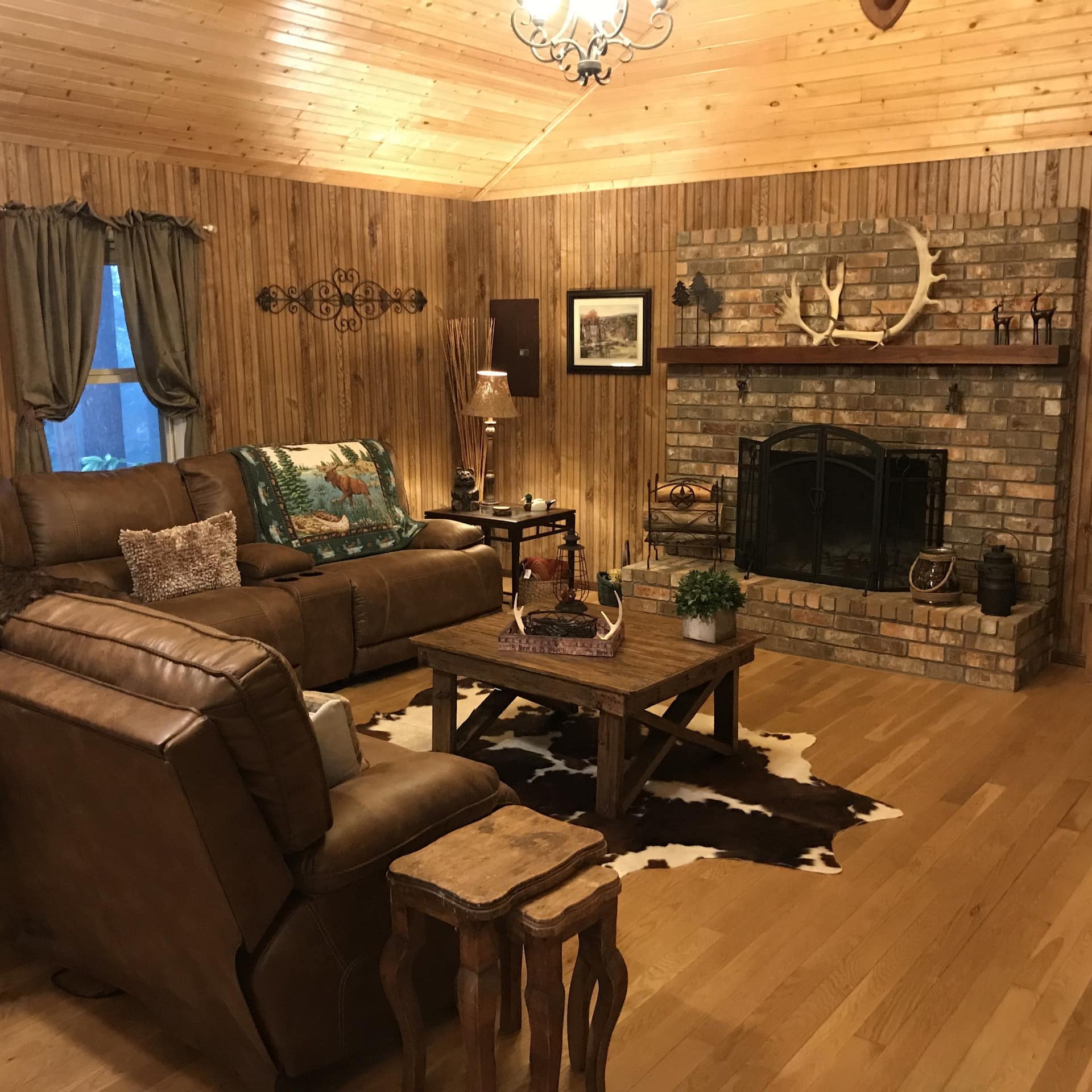 Rustic wood cabin interior with fireplace