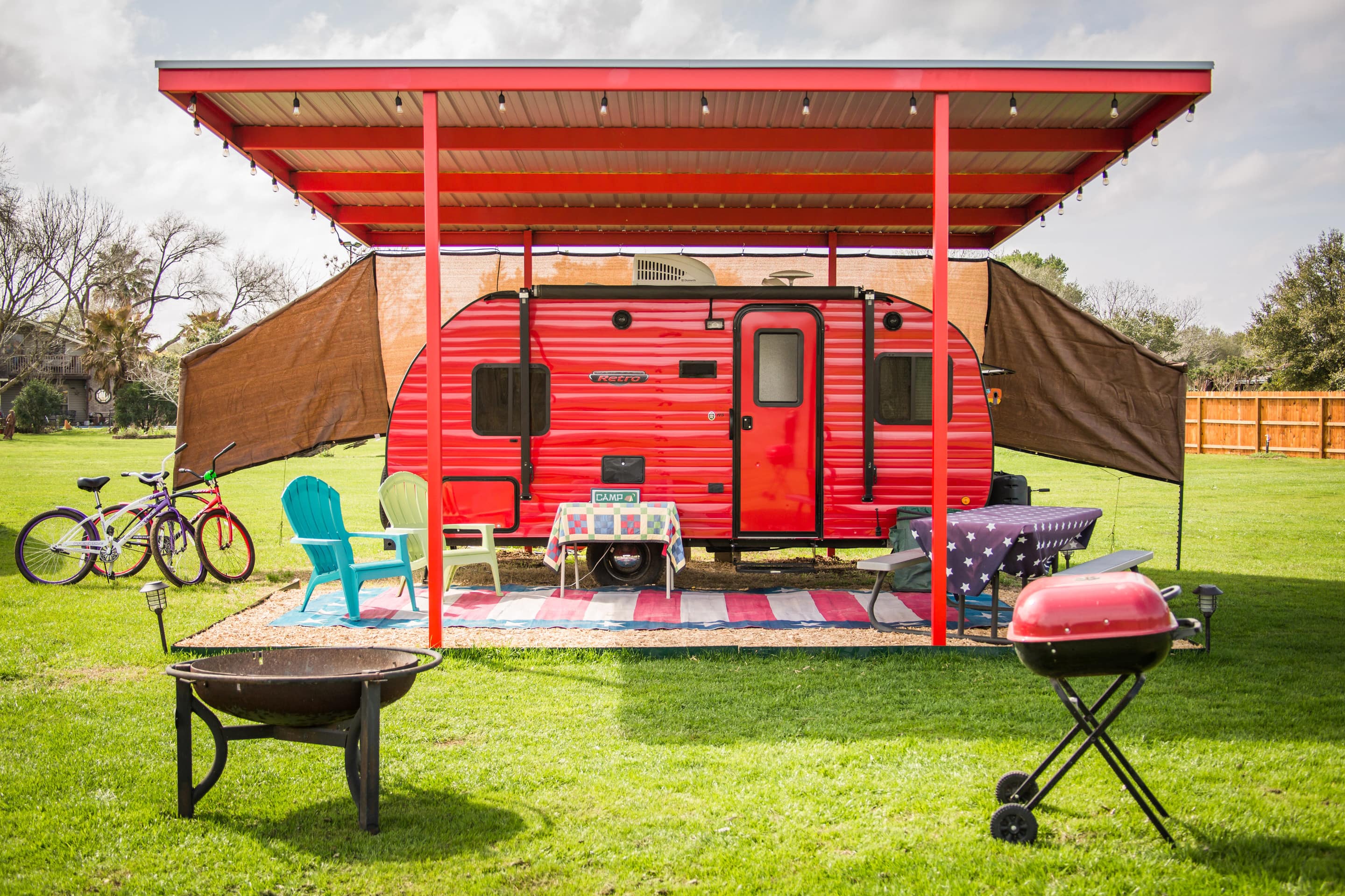 This is an image of a bright red camper.