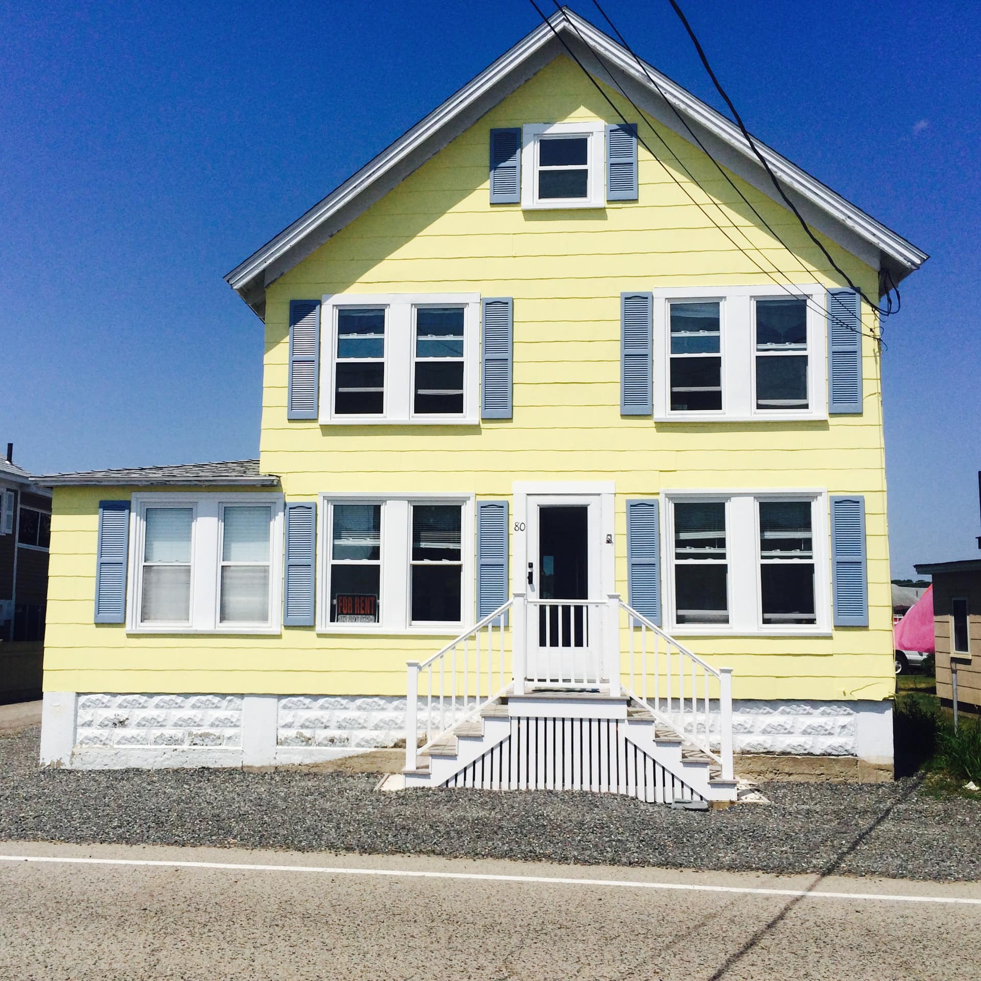 A brightly painted oceanfront vacation rental in Wells