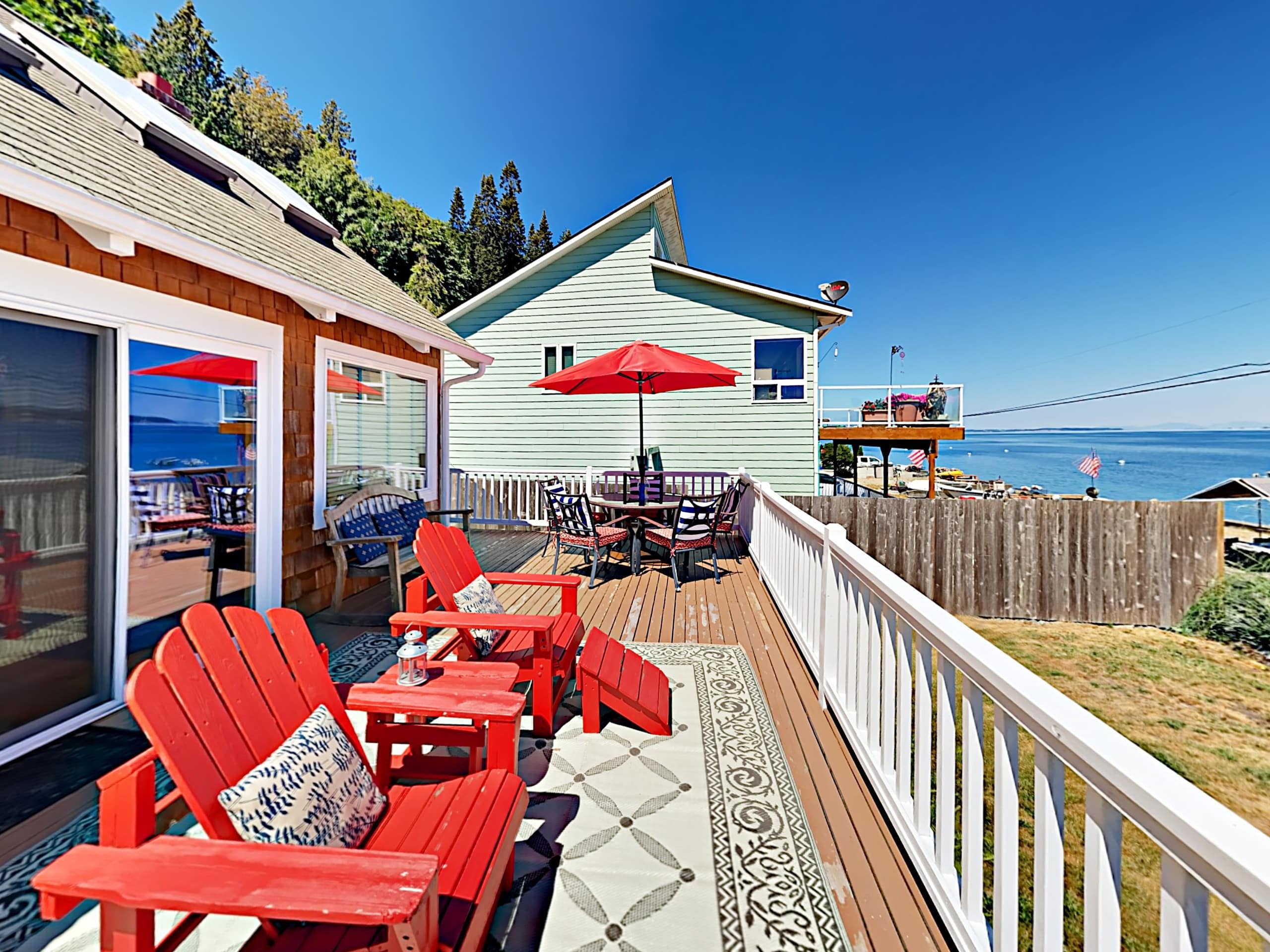 Waterfront deck with Adirondack chairs on Camano Island