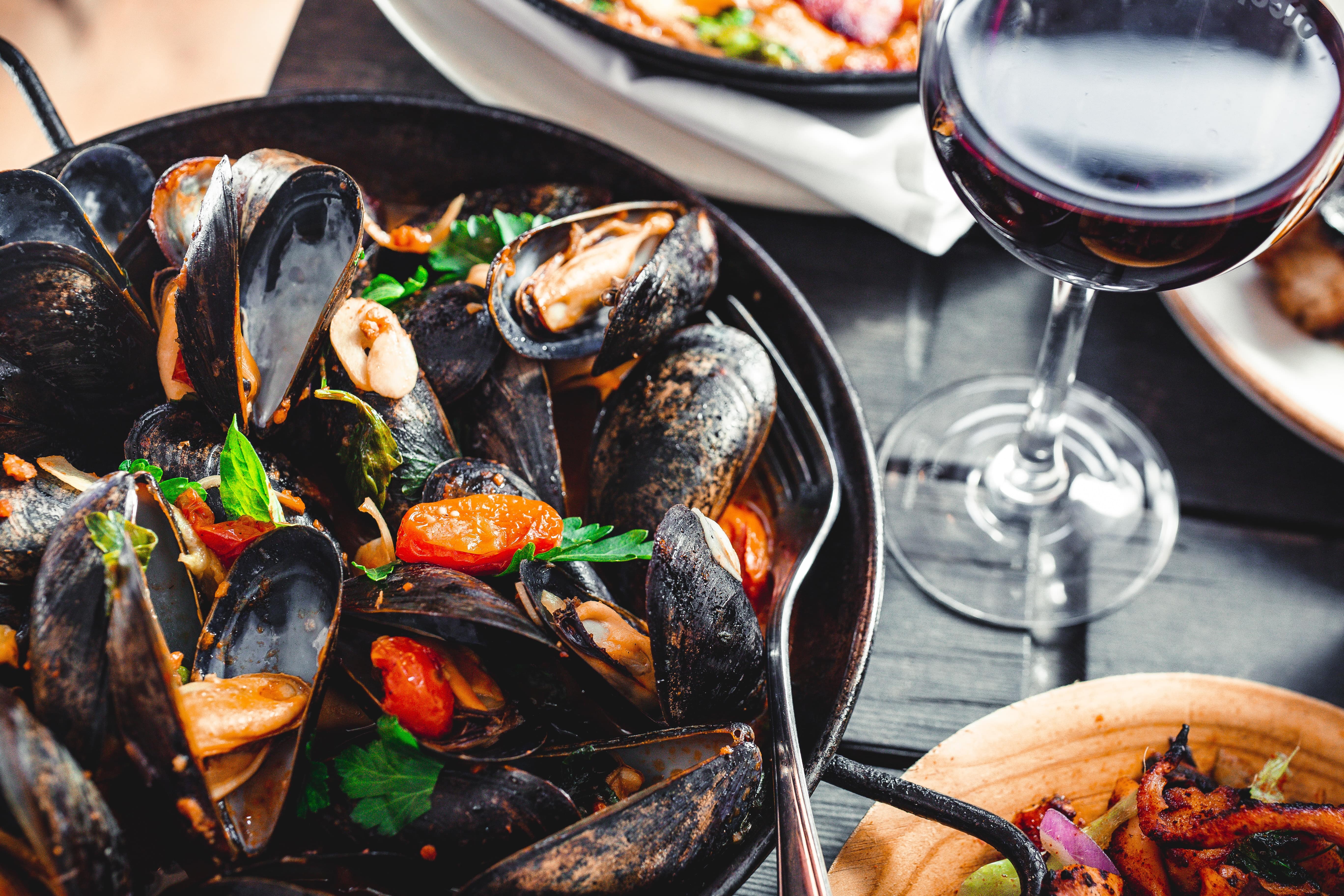 Stock photo - Seafood and red wine meal - Barcelona Wine Bar, Nashville, TN, USA - Photo by Andi Whiskey