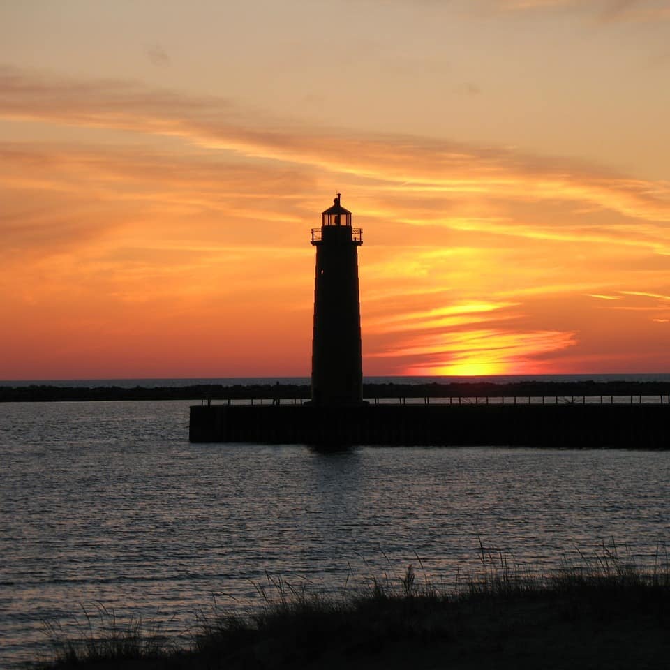 Lighthouse at sunset on Lake Michigan