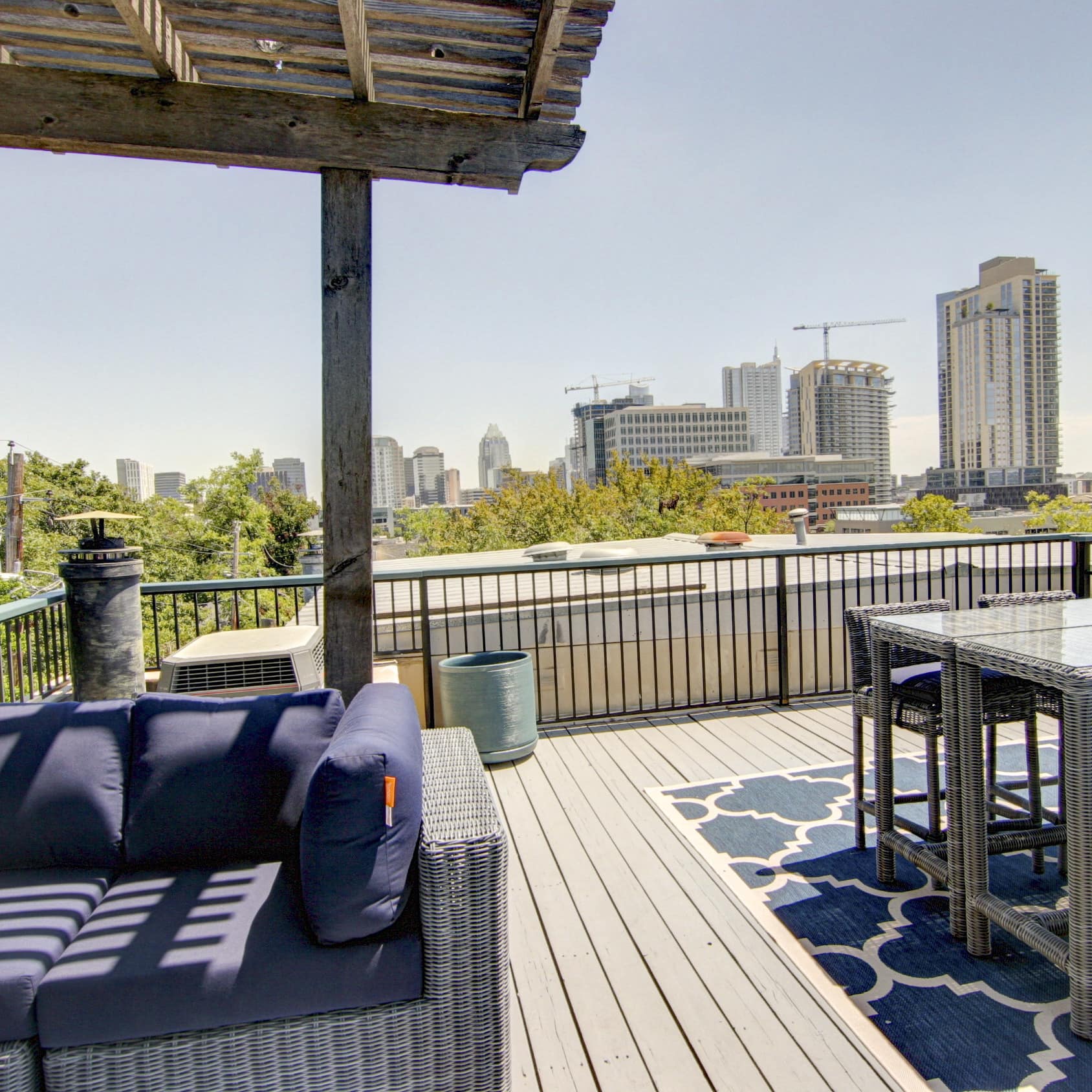 A sunny deck overlooks the high rises of Austin, TX