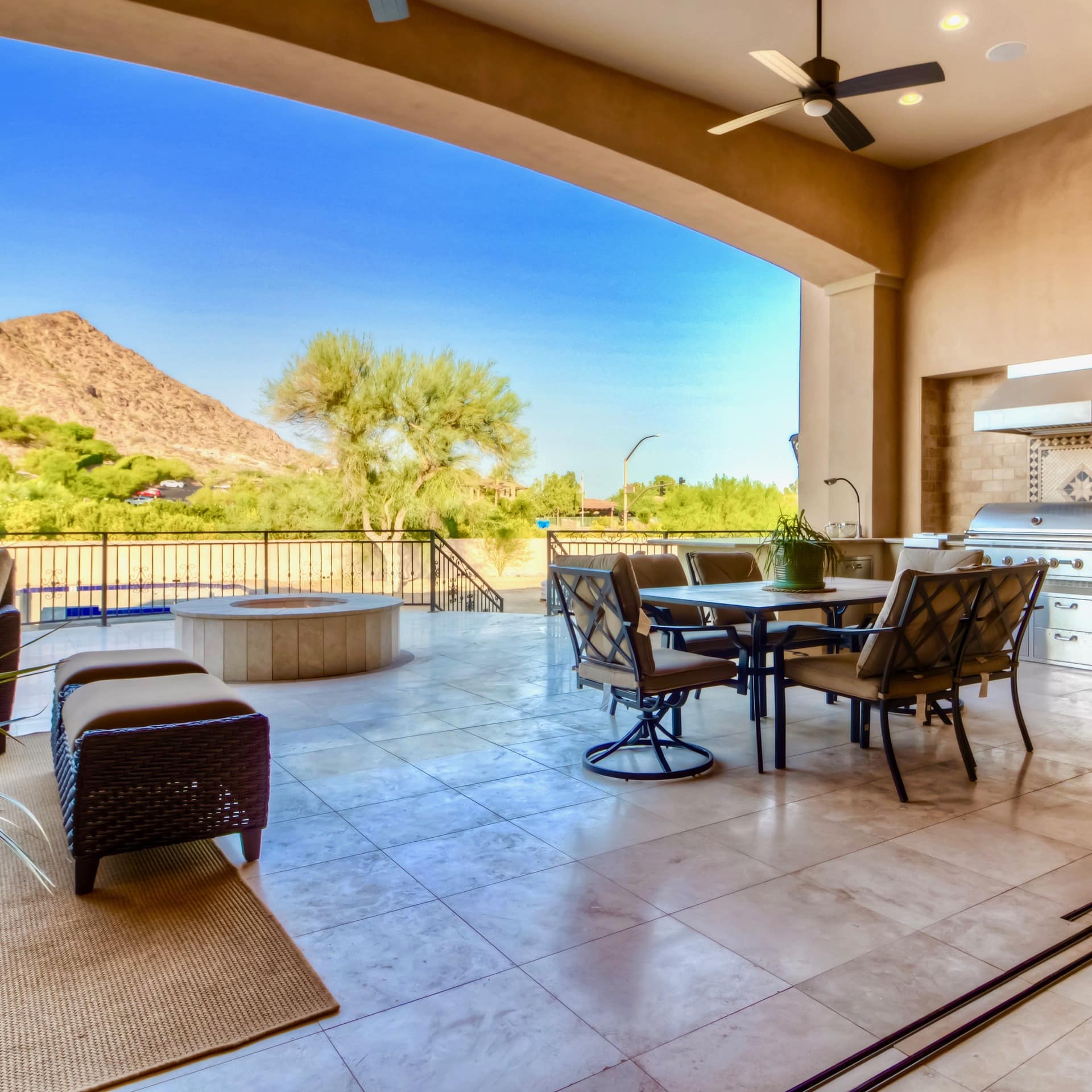 A luxury home rental's large, furnished deck with views of Camelback Mountain
