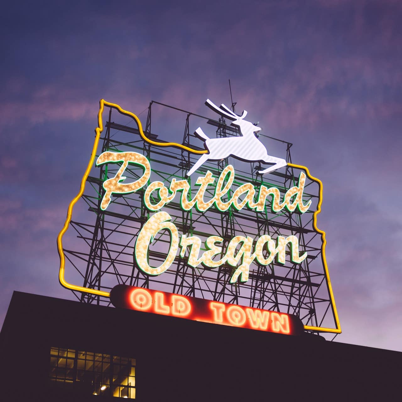 A neon sign welcomes visitors to Portland, Oregon