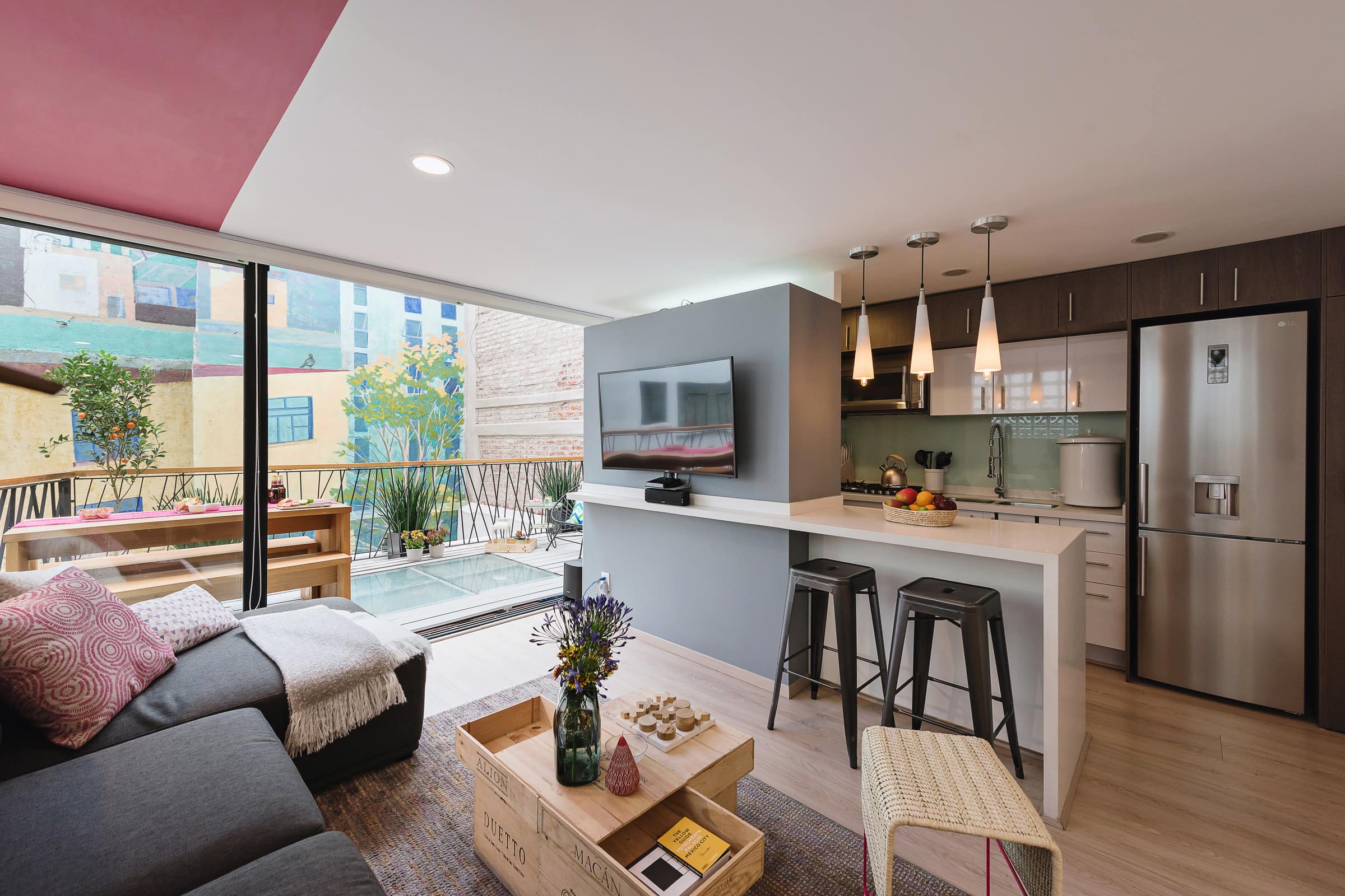 This chic 2-bedroom apartment in Roma Norte features a private outdoor terrace for guests to dine alfresco
