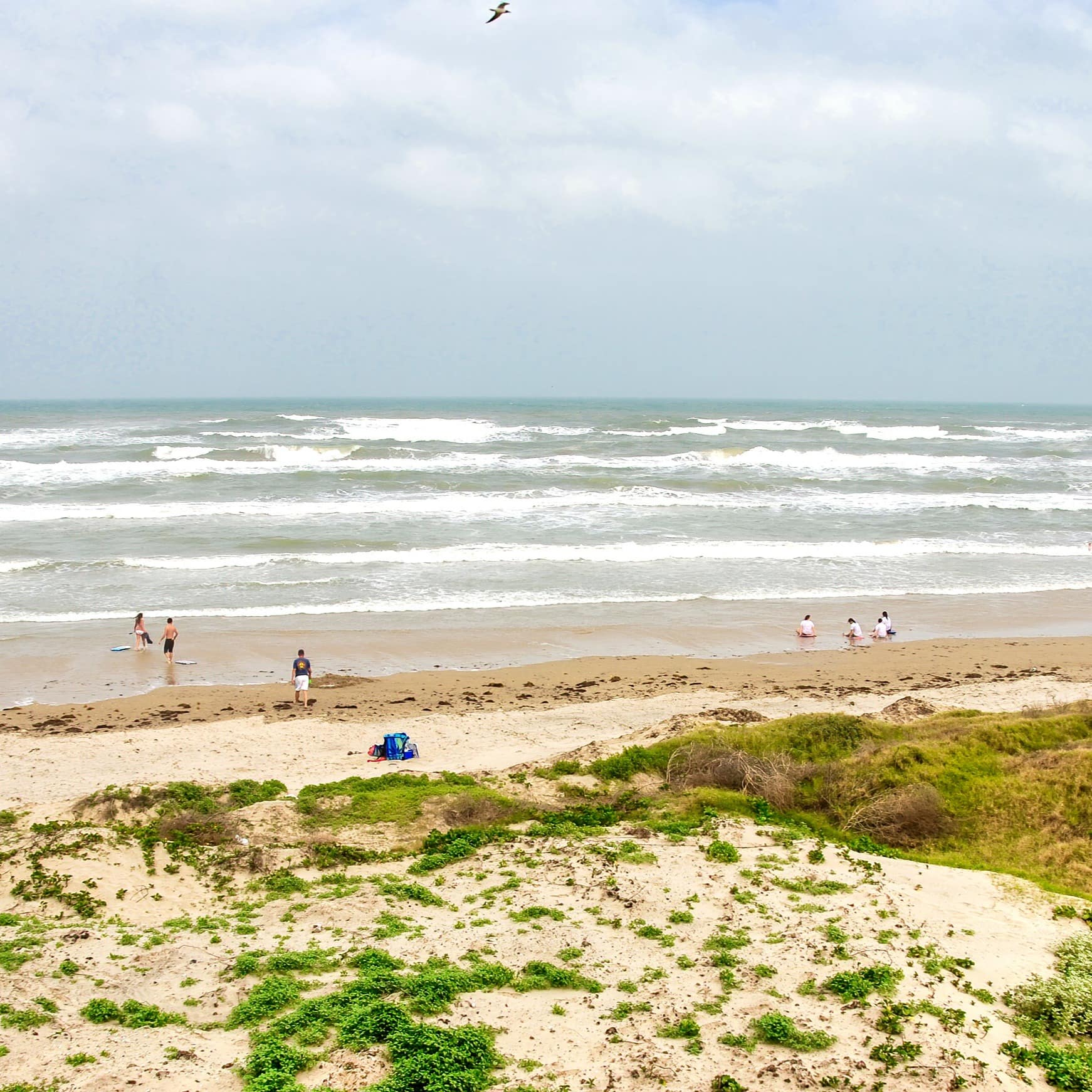 Few people on the beach on cloudy day at South Padre Island