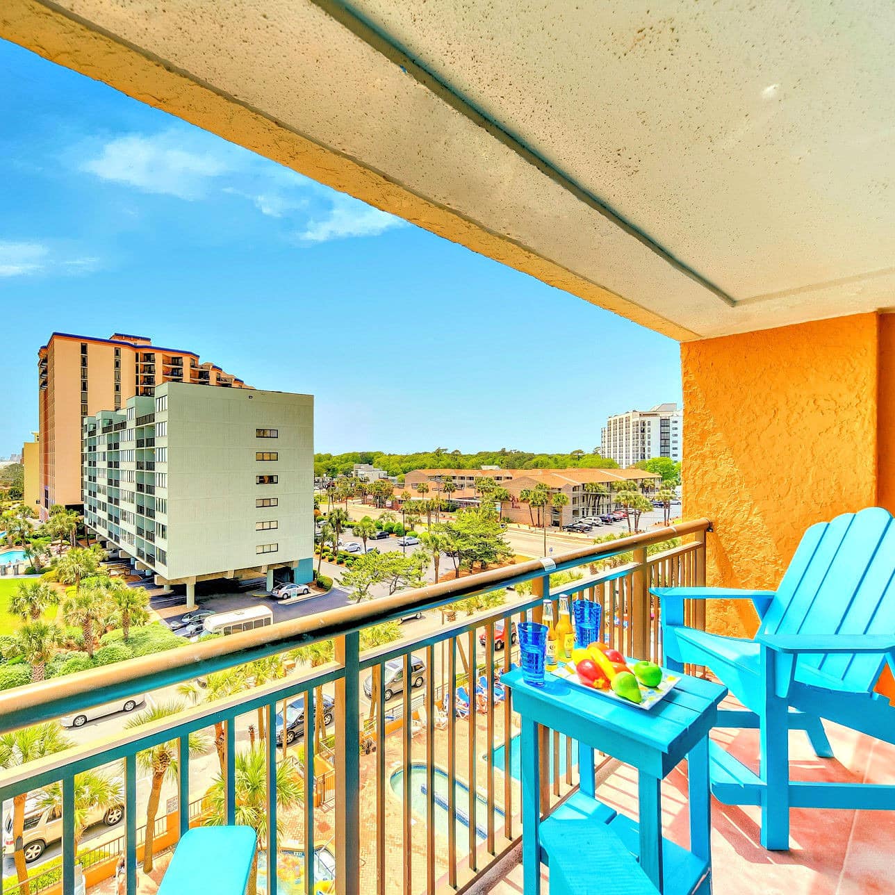 A vibrant view of palm gardens and sands from a Myrtle Beach vacation rental