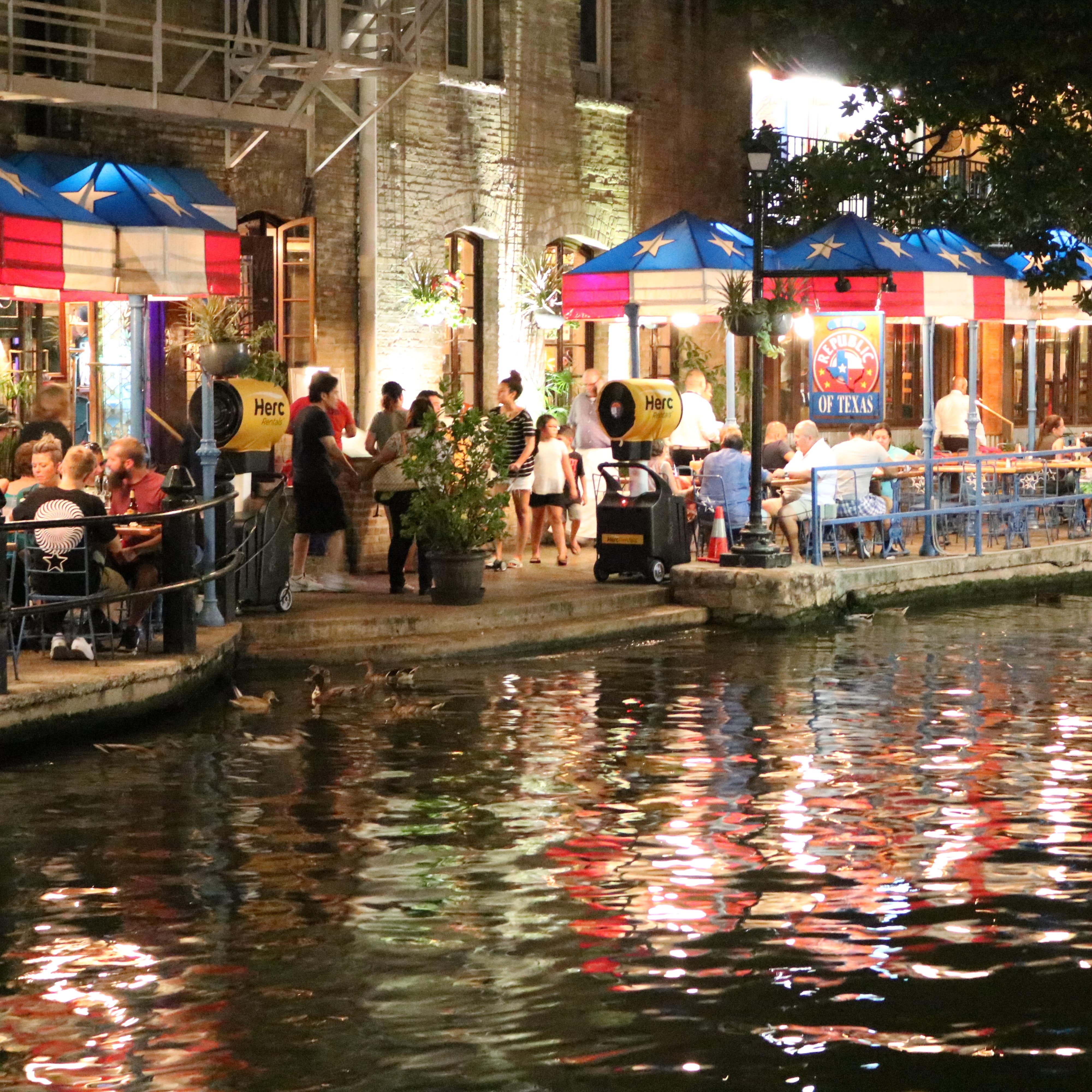 Busy eateries lining the River Walk in San Antonio, Texas