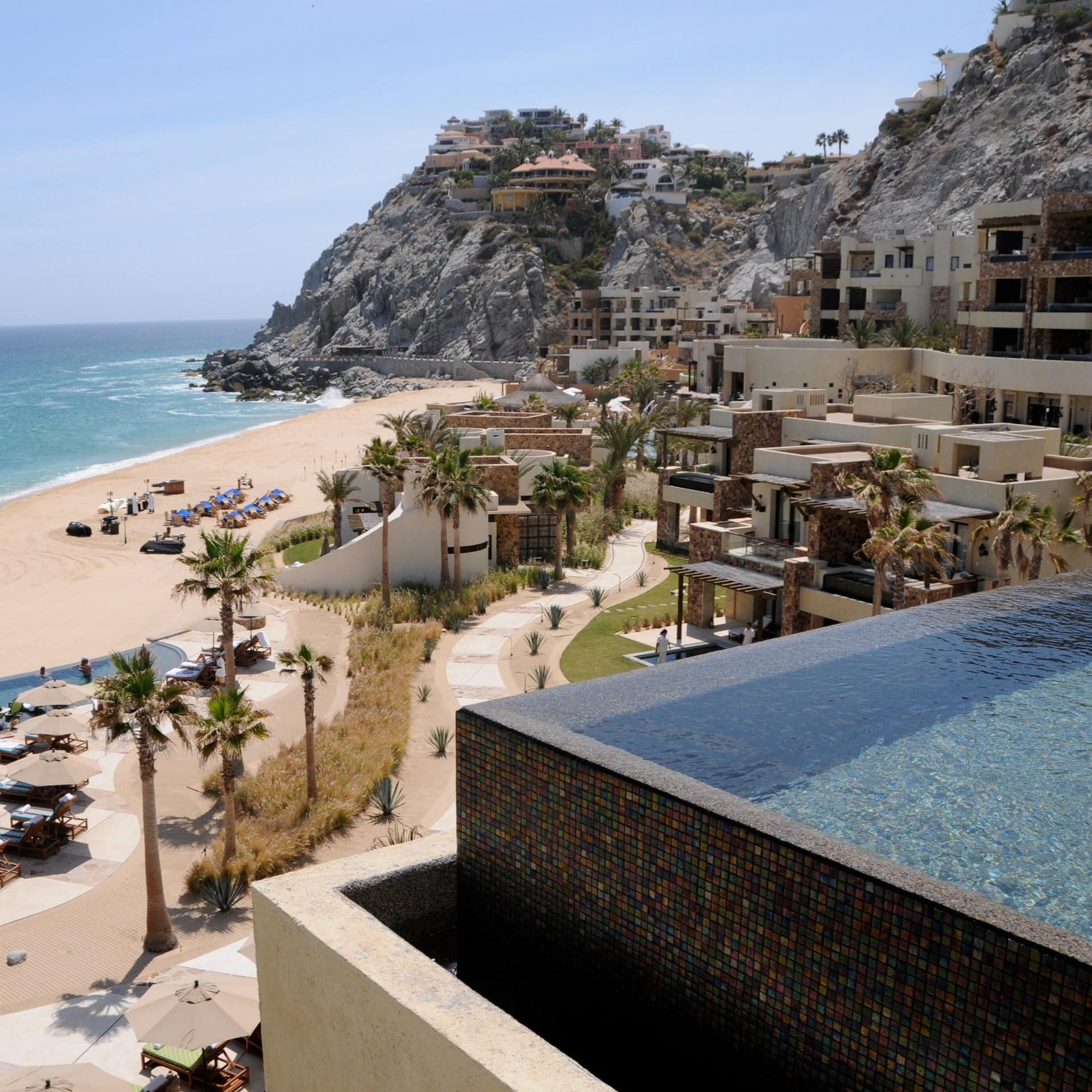 Sweeping views of The Resort at Pedregal, including its beachfront and its sprawling outdoor pool