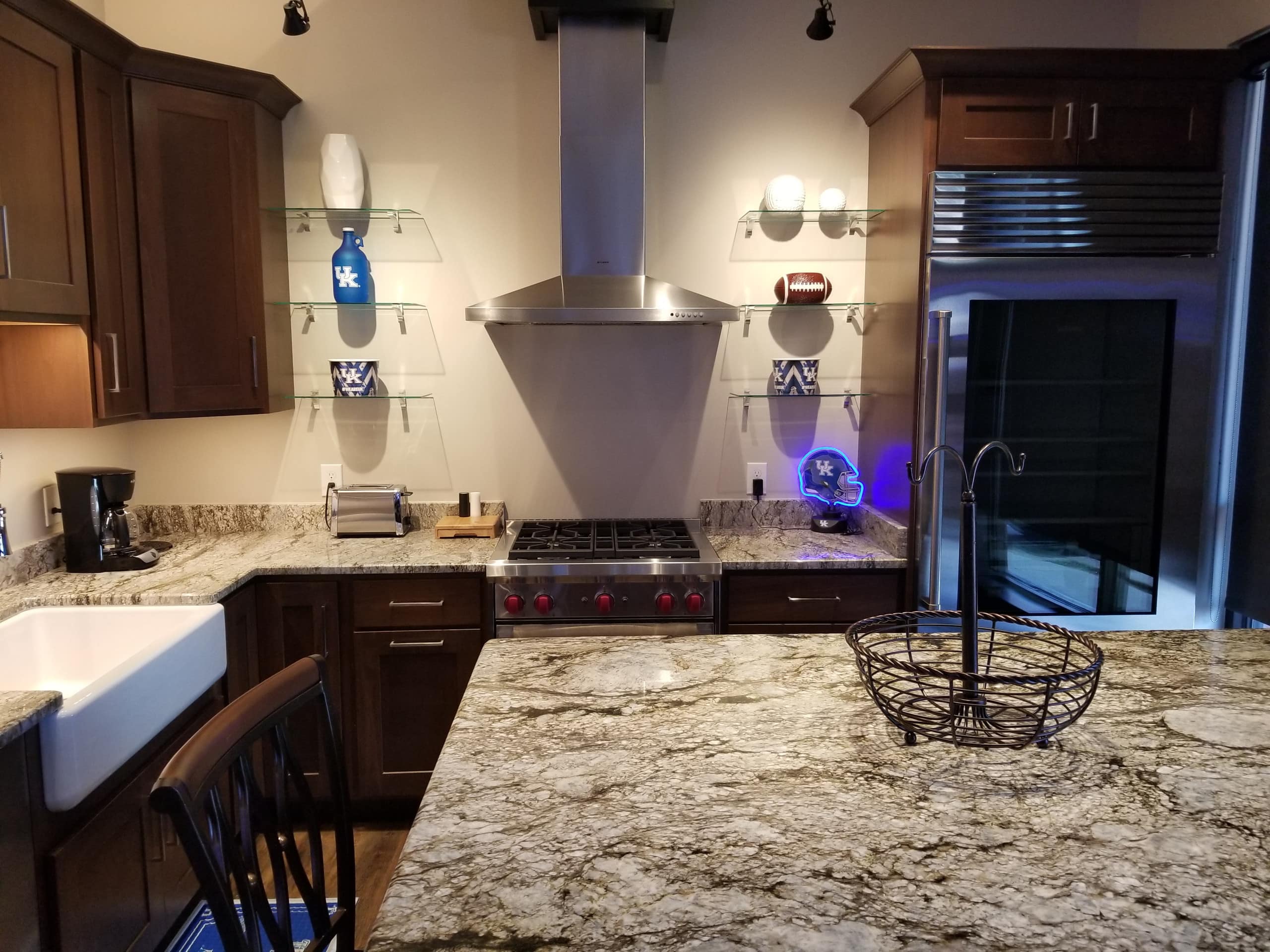 This University of Kentucky house has blue Wildcats decorations in the kitchen.