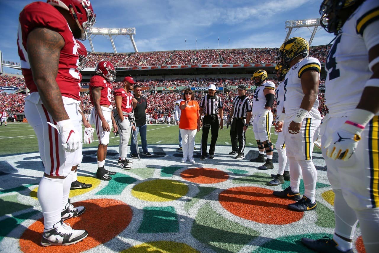This is a photo of the coin toss between Alabama and Michigan on the field during the 2020 Vrbo Citrus Bowl.