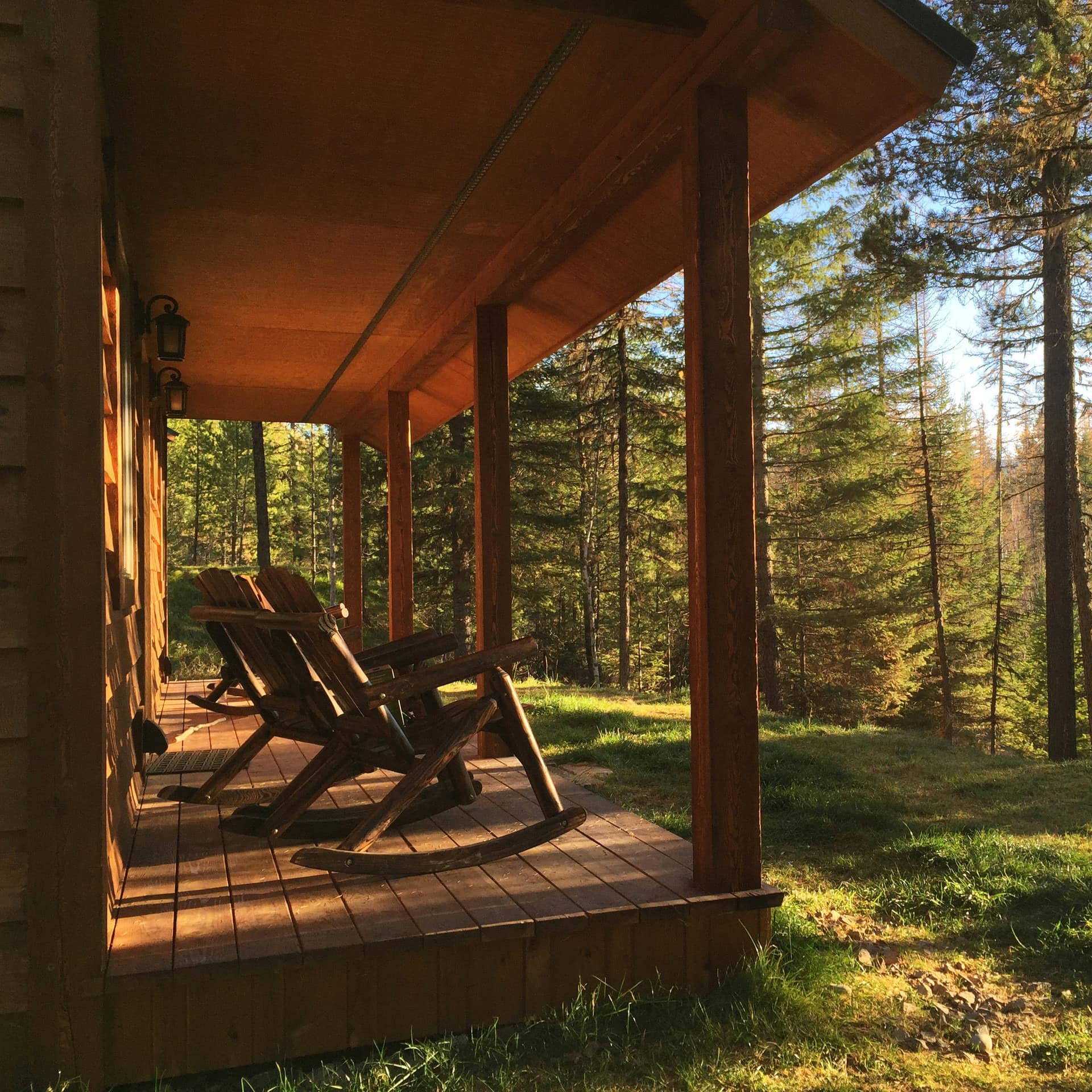 Rocking chairs on the scenic deck of a cabin in Glacier National Park